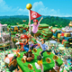 A mock up of Super Nintendo World, full of colorful characters and excited children.